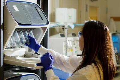 DNA Genotyping and Sequencing. Technician prepares for a viral whole-genome