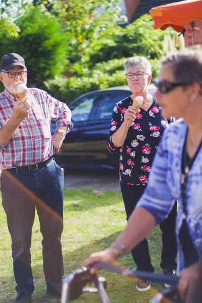 Two older people enjoying an ice cream.